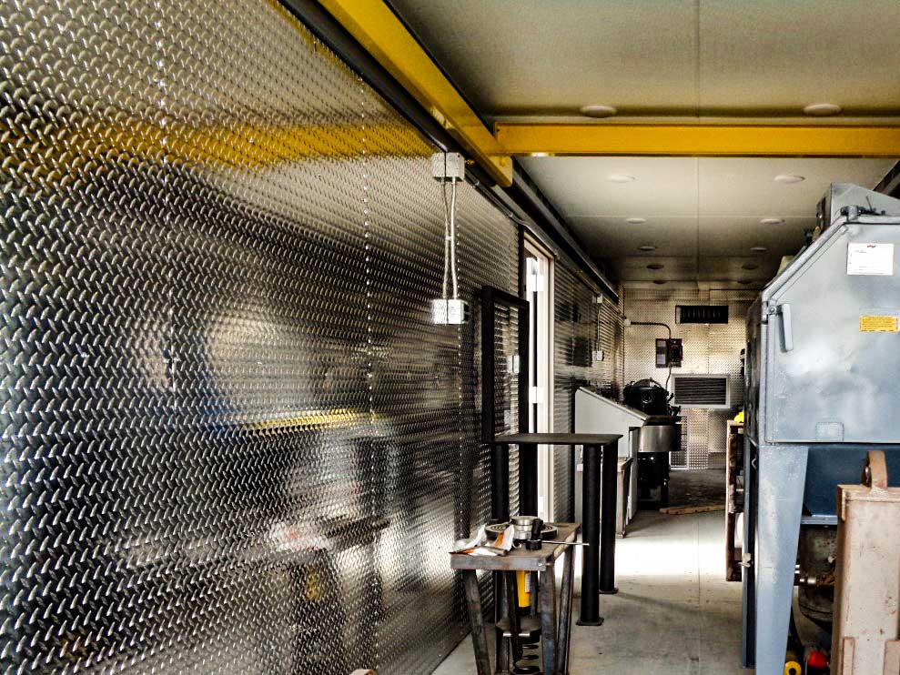 Diamond Plate steel wall panels installed in container