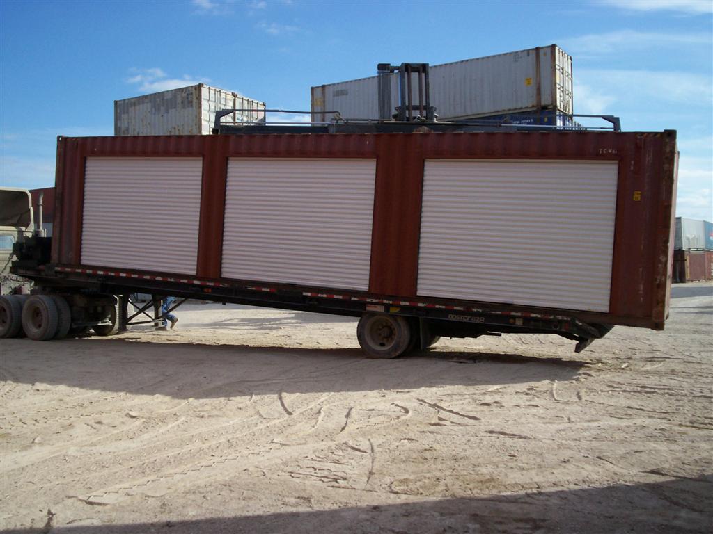 custom container with roll up doors being delivered