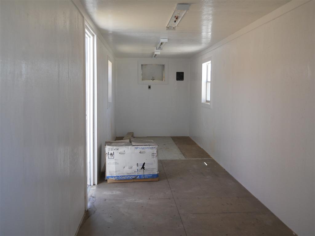 custom fabricated steel shipping container; custom interior; walls, A/C and electrical